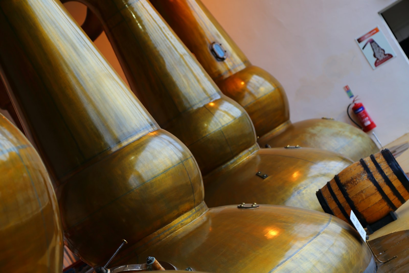 Polished copper stills in a row